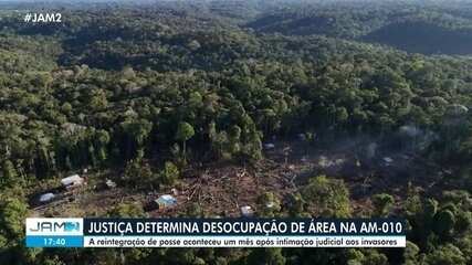 Forças de segurança fazem reintegração de posse de área nativa em estrada no AM