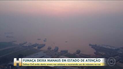 Densa fumaça volta a cobrir Manaus; alerta da Defesa Civil nos celulares recomenda que moradores saiam de casa com máscaras
